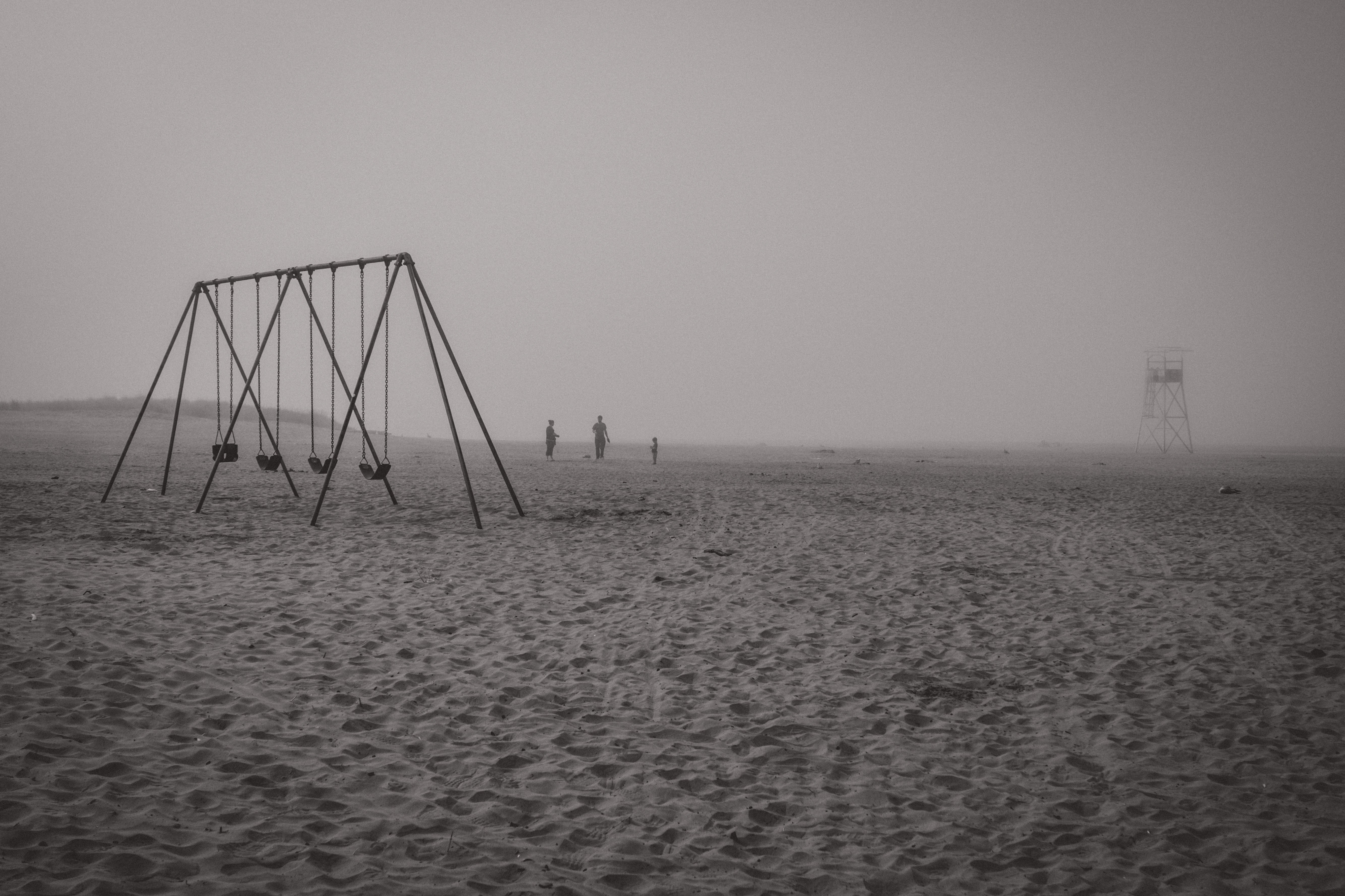 Empty Swings on a Misty Beach - Notice the Space